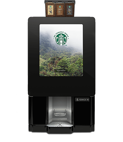 A starbucks coffee machine with the picture of a forest.